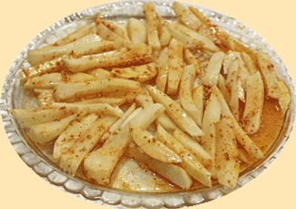 a dish sliced potatoes that are spiced