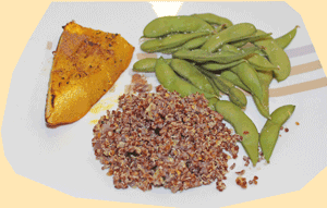 Cooked pumpkin slice served with cooked red quinoa and Edamame