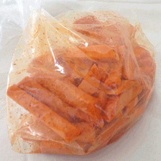 sweet potatoes, mixed with spices in zip lock bag